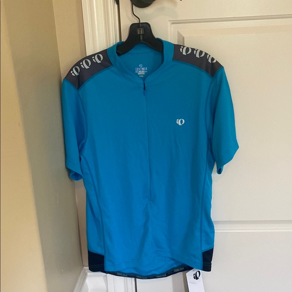 Men’s Pearl Izumi turquoise cycling shirt, size medium. New with tags attached.
